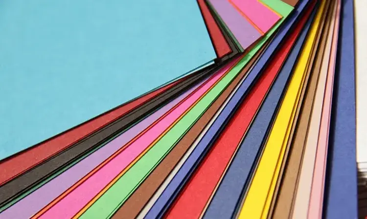 a close-up of different colored paper