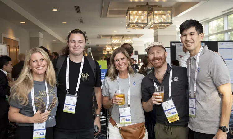 A group of people smiling for a photo at the 2026 ASBC & CIBD Meeting