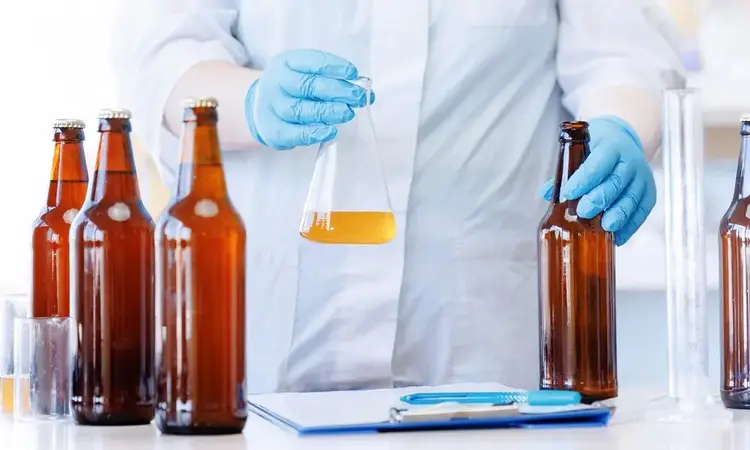 Bottled Beer and Glass Beaker