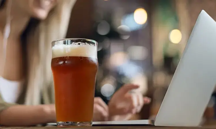 a glass of beer on a table